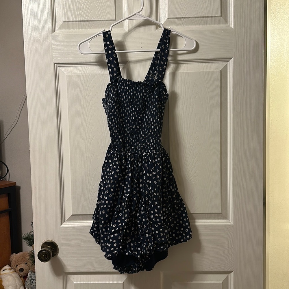 Hollister Mini romper! Sm sized navy blue romper, built in shorts, open tie back